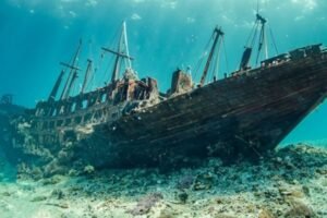 Old Sunken boat resting on bottom of ocean